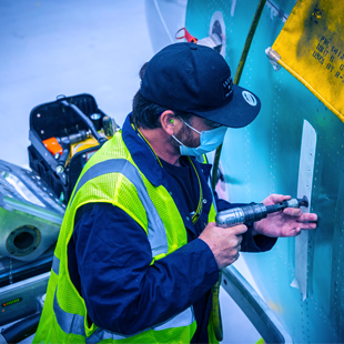 Workers building plane